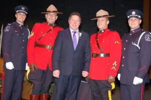 Mike posing with the RCMP and Surrey Fire Department Honour Guard